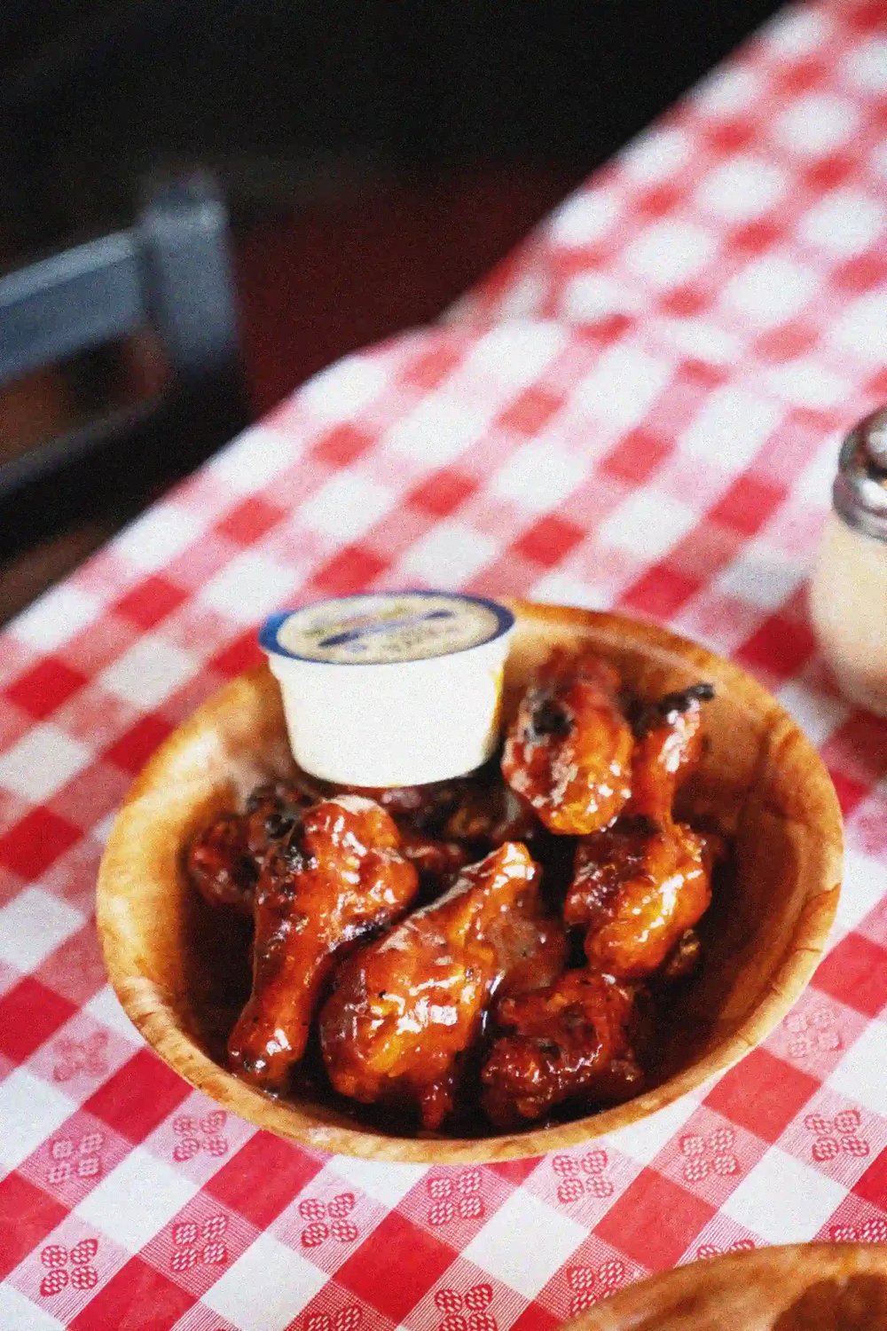 A bowl of Buffalo wings with blue cheese