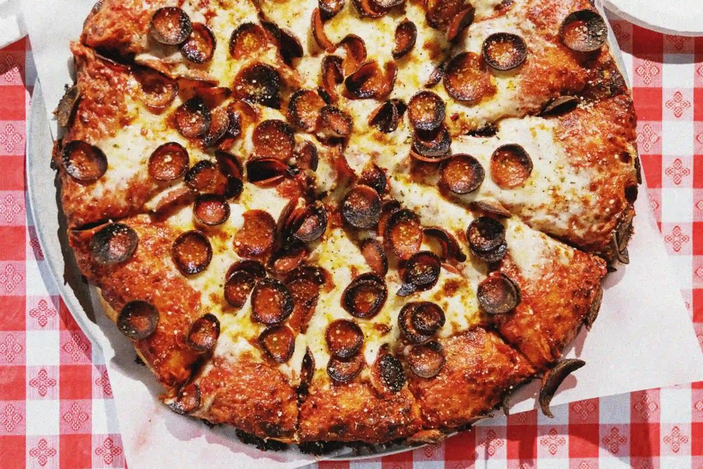 A flatlay of Santora's pizza on a sheet